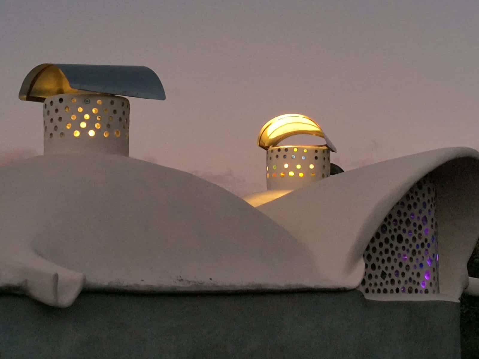 Glowing domes of the Asklepieion at dusk at Rainbow Bridge Hawaii, a healing space under construction