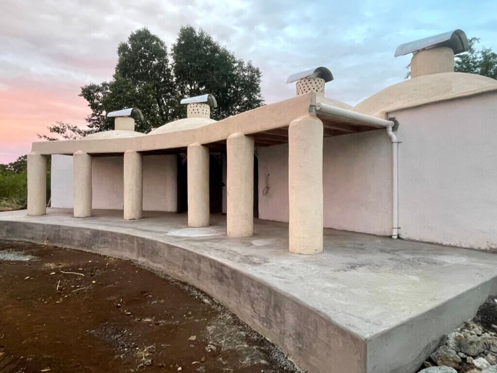 Modern Asklepieion dream incubation temple under construction at Rainbow Bridge Hawaii, designed for lucid dreaming and sacred dream retreat practices