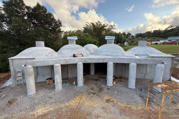 Front view of the Asklepieion under construction at Rainbow Bridge Hawaii, a dome-style healing space