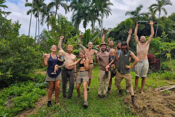 Community members celebrating after garden work at Rainbow Bridge Hawaii